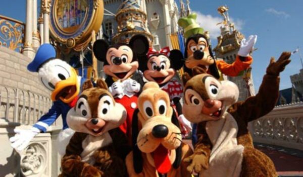 Mickey Mouse, Minnie Mouse, Donald Duck, Goofy, Pluto, Chip, and Dale in front of Cinderella Castle