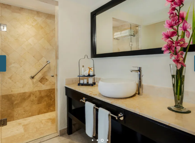 Dreams Los Cabos Family Junior Suite Ocean View marble bathroom with vessel sink and walk-in shower