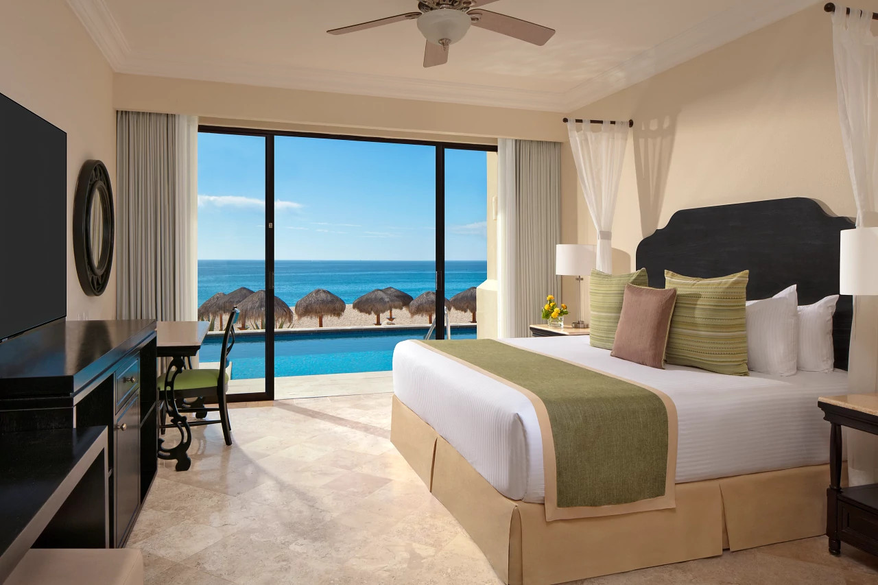 Dreams Los Cabos Junior Suite Swim Out bedroom with pool and ocean view