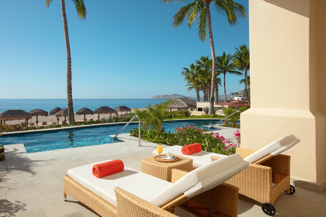 Dreams Los Cabos swim-out patio with ocean and palapa beach views